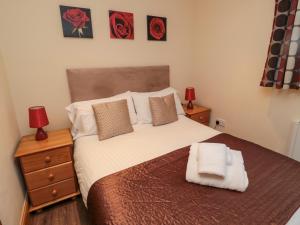 Voodi või voodid majutusasutuse Fir Tree Cottage toas