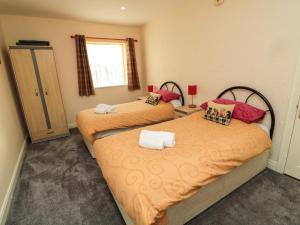 Voodi või voodid majutusasutuse Stable Cottage toas