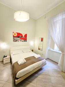 A bed or beds in a room at Maison Carolina