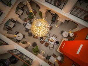 an overhead view of a living room with a chandelier at Sur Royal's Hotel in Diyarbakır