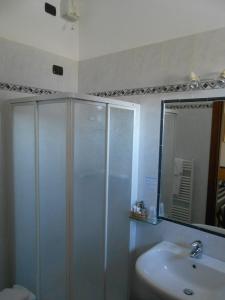 a bathroom with a shower and a sink at Albergo Villa Eva in Costermano sul Garda +40 photos