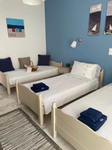 Posteľ alebo postele v izbe v ubytovaní ILEKTRA Apartments Blue & Red