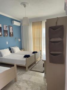 Posteľ alebo postele v izbe v ubytovaní ILEKTRA Apartments Blue & Red