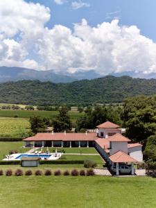 an aerial view of a house with mountains in the background at Finca Las Margaritas in Chicoana