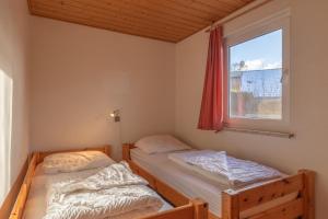 Ένα ή περισσότερα κρεβάτια σε δωμάτιο στο Möwe 35