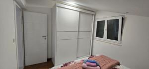 Postel nebo postele na pokoji v ubytování Apartman Grošić