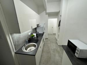 Kuchyň nebo kuchyňský kout v ubytování Stuart apartman