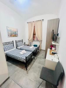 A bed or beds in a room at Grandis Rooms