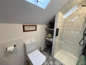 a bathroom with a toilet and a shower at Loft apartment in Accrington Stunning Lancashire views in Church +34 photos