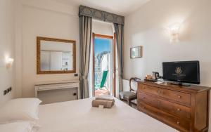 Postel nebo postele na pokoji v ubytování Hotel Porto Roca