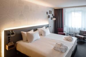 Postel nebo postele na pokoji v ubytování pentahotel Liège + 37 fotografií