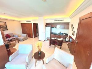 a living room with a couch and a table at King Suites Hotel in Beirut