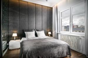 Posteľ alebo postele v izbe v ubytovaní RentPlanet - Studio Ruska