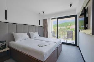 Postel nebo postele na pokoji v ubytování Hotel Ad Turres