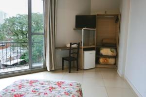 Postel nebo postele na pokoji v ubytování Moura Palace Hotel