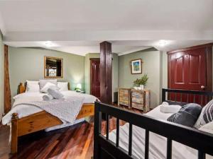 a bedroom with two beds and a couch at Pemberton Forest View Retreat in Pemberton