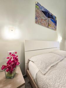 A bed or beds in a room at Maison Carolina
