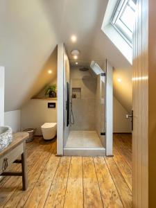 a bathroom with a shower in the attic at Luxury Cotswold Retreats in Moreton in Marsh +37 photos