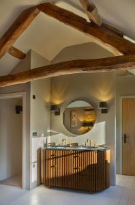 a kitchen with a round mirror on the ceiling at Luxury Cotswold Retreats in Moreton in Marsh