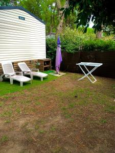 Mobil home climatisé 6,8 Pers SIBLU BONNE ANSE PLAGE LA PAMYRE LES MATHES外面的花园