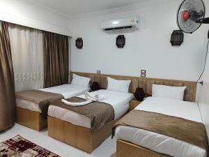 Postel nebo postele na pokoji v ubytování JJ Guesthouse
