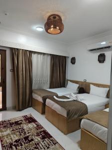 Postel nebo postele na pokoji v ubytování JJ Guesthouse