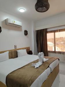 Postel nebo postele na pokoji v ubytování JJ Guesthouse