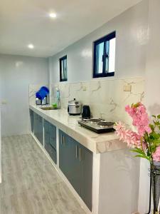a kitchen with a counter and a counter top at MC2 Homestay Butuan in Butuan