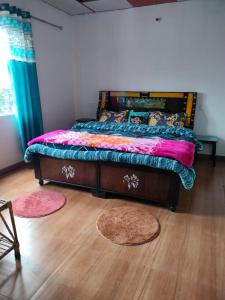 Ein Bett oder Betten in einem Zimmer der Unterkunft Moon Hotel Tungnath