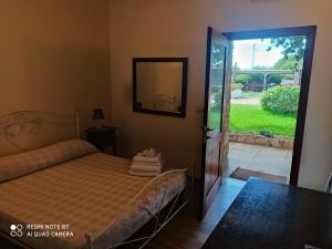 Postel nebo postele na pokoji v ubytování Agriturismo Zio Zac + 37 fotografií