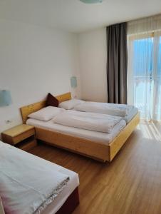 Postel nebo postele na pokoji v ubytování Pension Auerhof