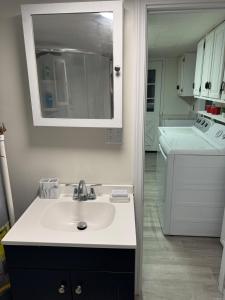 a white sink in a kitchen with a counter top at Pennsboro WV 'Country Roads' in Pennsboro