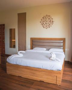 Ένα ή περισσότερα κρεβάτια σε δωμάτιο στο Thavika Silverwoods Residence