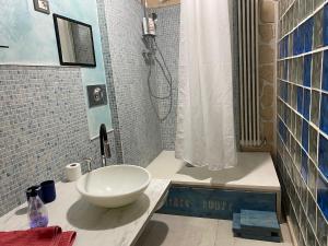 a bathroom with a sink and a shower at Fantasy House in Cremona +26 photos