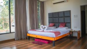 Ένα ή περισσότερα κρεβάτια σε δωμάτιο στο Thavika Silverwoods Residence