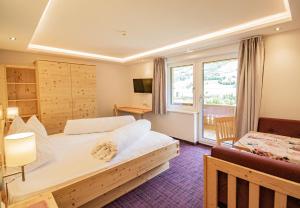 Posteľ alebo postele v izbe v ubytovaní Hotel Stolz