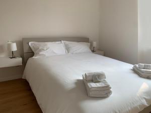 Letto o letti in una camera di Spazio Perlasca Apt 2 - Cernobbio Como Lake