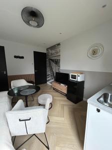 Kuchyň nebo kuchyňský kout v ubytování De Zilten Kaēmer Zoutelande + 18 fotografií