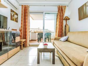 a living room with a couch and a table at Apartment La Mar Bella by Interhome in El Borseral
