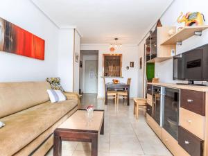 a living room with a couch and a table at Apartment La Mar Bella by Interhome in El Borseral +23 photos