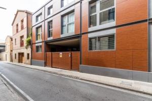 an empty street in front of a building at Petit Luxe Mutua in Terrassa