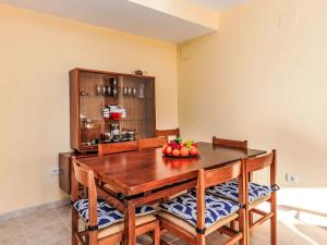 a dining room table with a bowl of fruit on it at Apartment Las Terrazas- La Marina-1 by Interhome in Oropesa del Mar