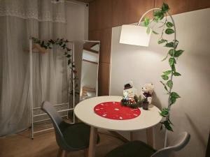 a small table with a teddy bear on it in a room at Comfort House 2 bed room Hwagok Station 4minutes Gimpo Airport 10 minutes in Seoul