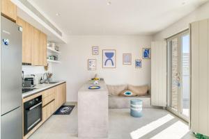 a kitchen with a table in the middle of it at Villa Gypsea - Paros in Aspro Chorio Paros