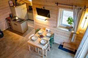 an overhead view of a kitchen and a table in a room at Homemade Apartment in Liebshausen