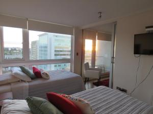 Krevet ili kreveti u jedinici u okviru objekta Concepción Suites