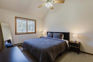 a bedroom with a bed and a ceiling fan at PS-1000 Cloud Cap in Pagosa Springs