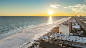 an aerial view of the beach at sunset at Beachfront - 2 Bedrooms - Big Screen TV in Gulf Shores