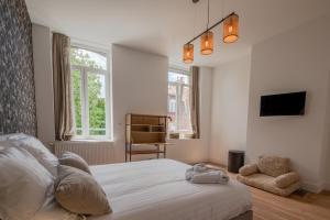 Ένα ή περισσότερα κρεβάτια σε δωμάτιο στο Maison Plaine Images - COLODGE