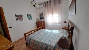 Ένα ή περισσότερα κρεβάτια σε δωμάτιο στο CasaSicula - Calypso Sea House